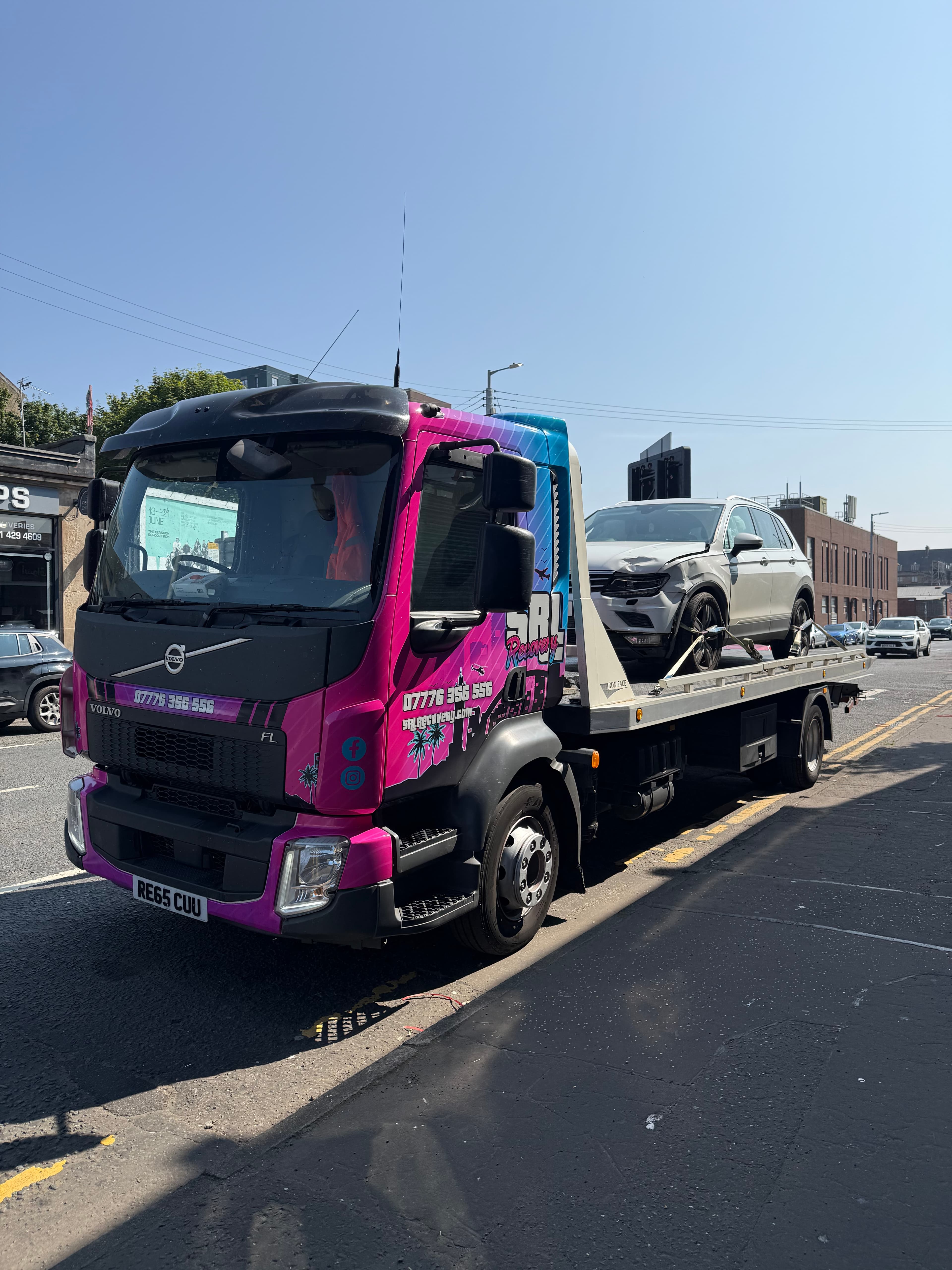 SRL Recovery flatbed truck loading a VW Tiguan after a non-fault accident in Tradeston, Glasgow